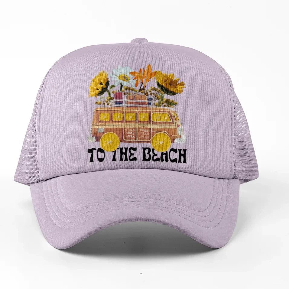 Tea Shirt Shoppe Wholesale lavender trucker hat with retro van and flowers graphic, "TO THE BEACH" text.