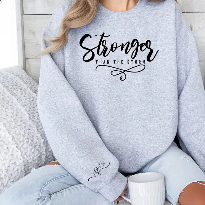 Stronger Than The Storm Graphic Sweatshirt Sweatshirt Tea Shirt Shoppe Small Sport Grey