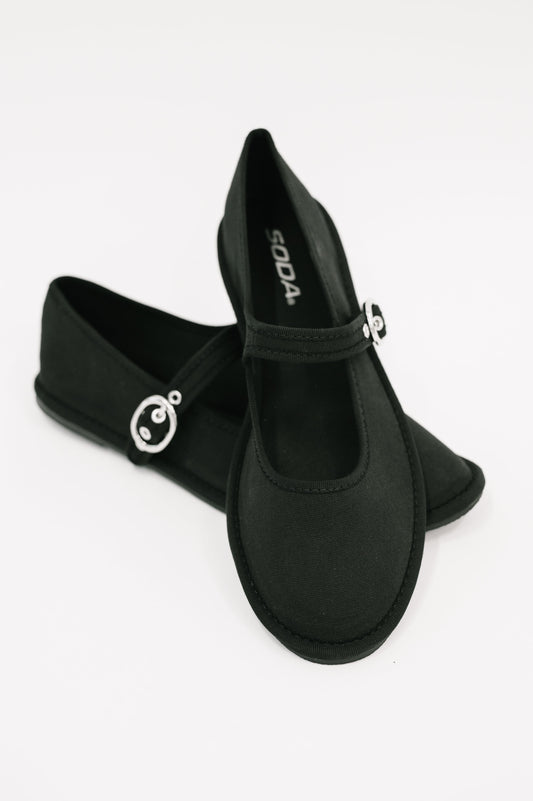 Fleta Buckle Flats in Black – soft cotton with buckle strap detail, true-to-size fit