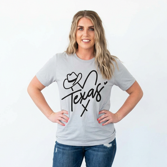 Woman wearing a gray t-shirt with 'Love Texas' design and blue jeans against a white background