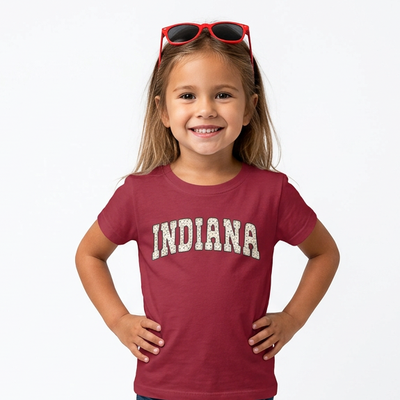 Young girl wearing a red 'Indiana' t-shirt on a white background