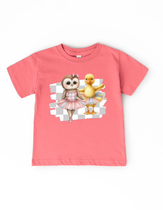 Pink t-shirt with cartoon owl and duck design on a white background