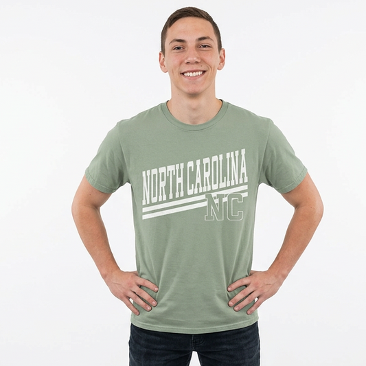 Person wearing a green 'North Carolina' t-shirt on a white background