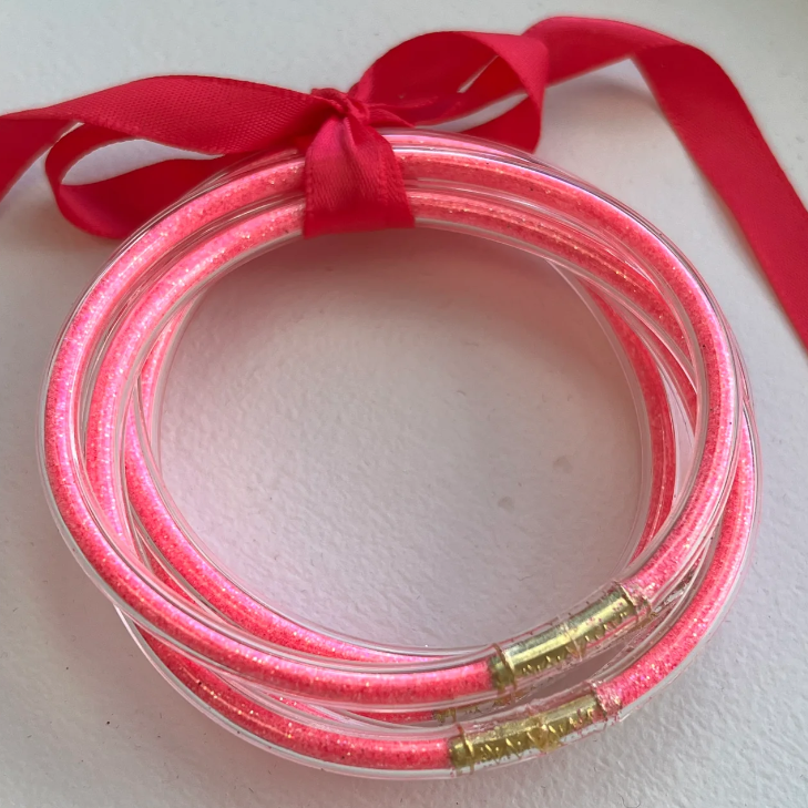 Jelly bracelet filled with hot pink glitter set of five.