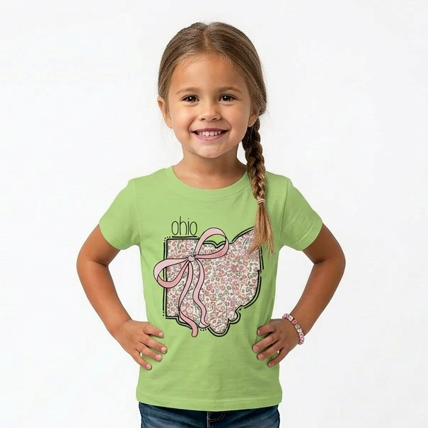 Young girl wearing a green t-shirt with a  Ohio design on a white background