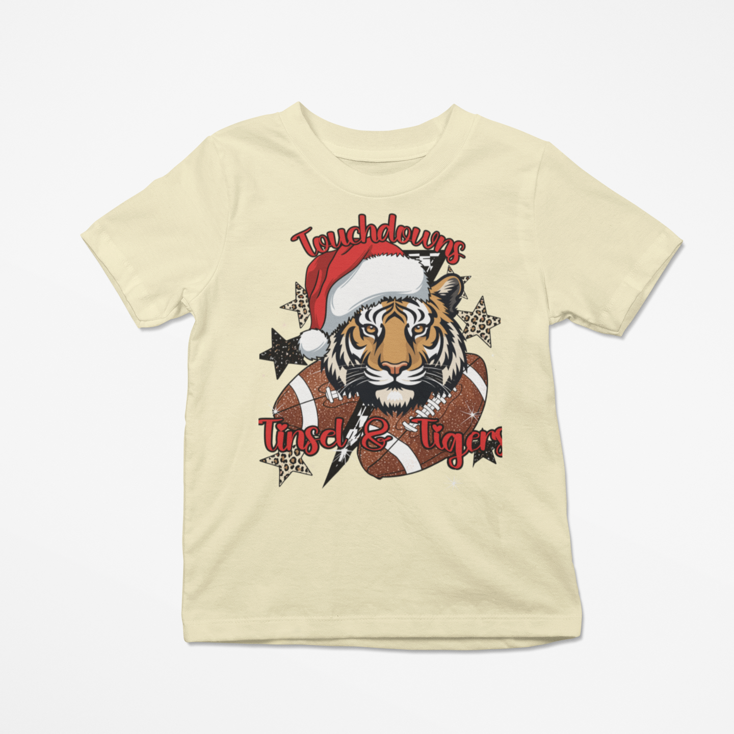 Beige t-shirt with a tiger graphic wearing a Santa hat and text on a white background