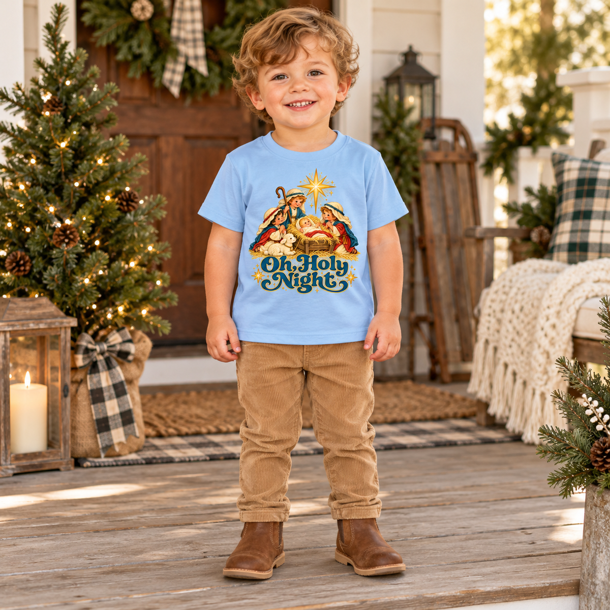 Toddler wearing Light Blue Oh, Holy Night tee on a Christmas porch