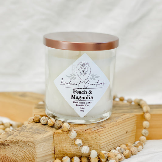 Peach & Magnolia Scented Candle Welcome to the paradise of Peach & Magnolia Scented Candle! Lionheart Creation's candle will fill your home with a sensational treat - the perfect combination of fresh citrus and magnolia. 