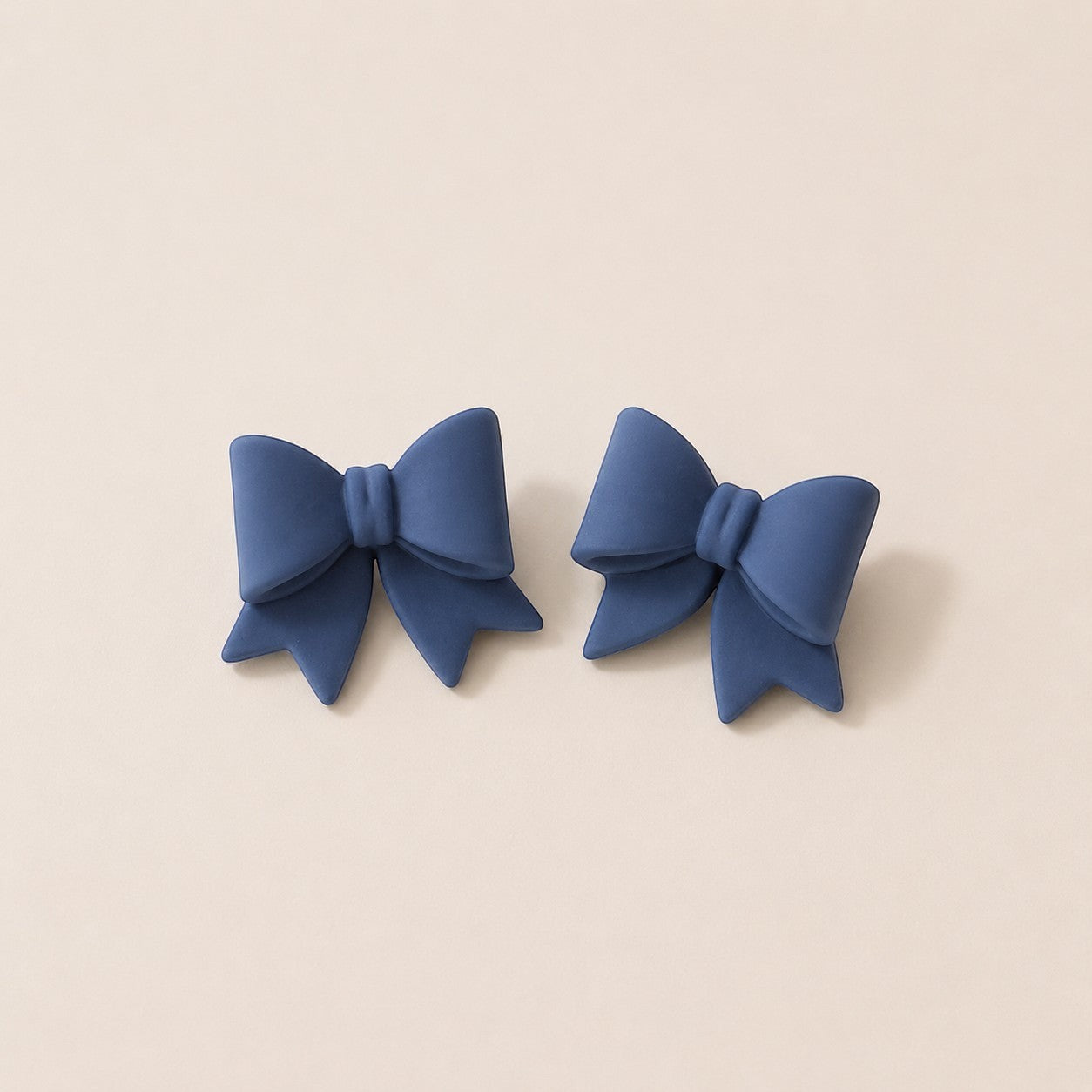 Tea-Shirt Shoppe blue clay bow earrings, handcrafted jewelry.