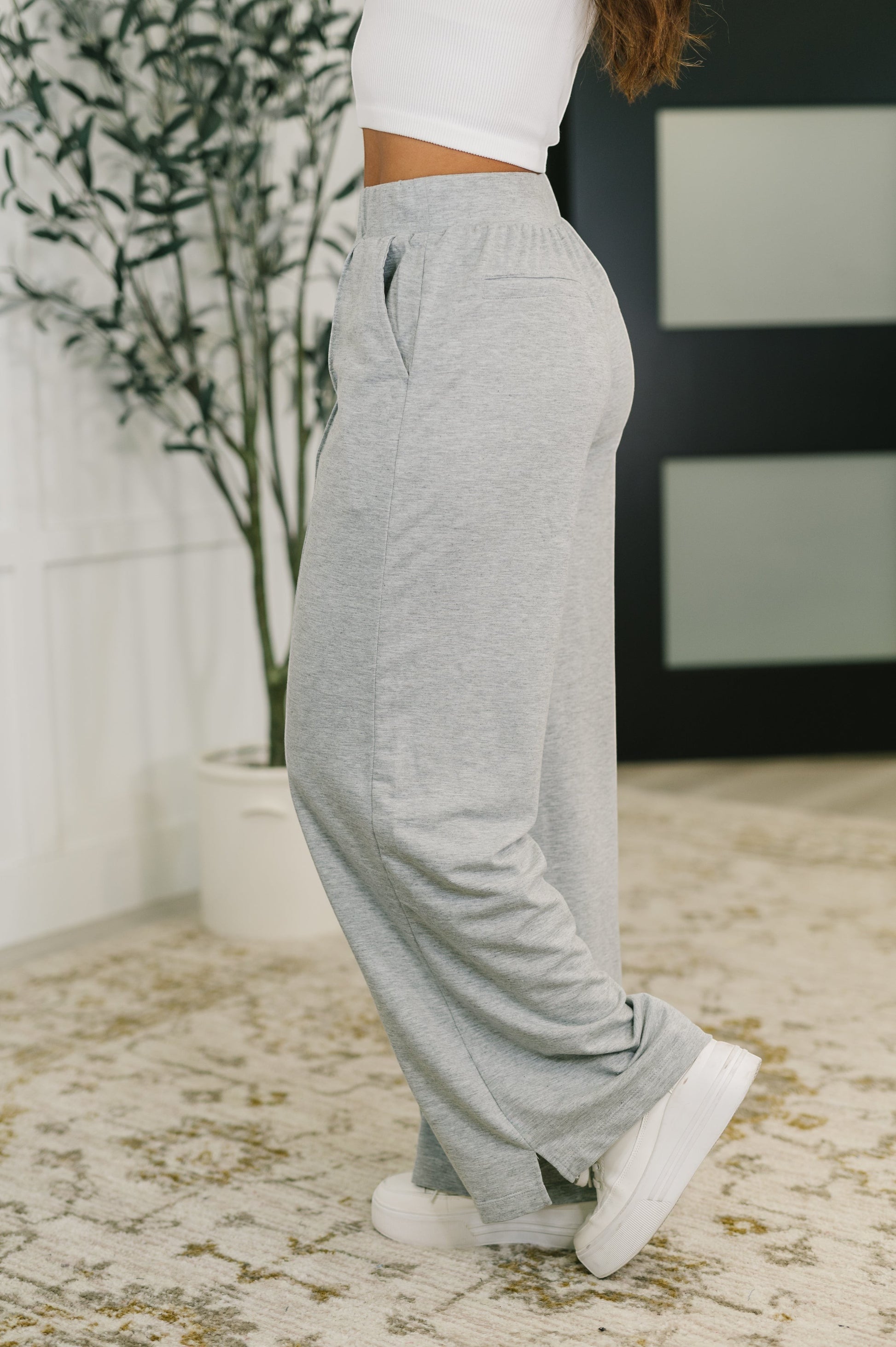 Tea-Shirt Shoppe grey knit wide leg pants with elastic waistband and side pockets worn by a model