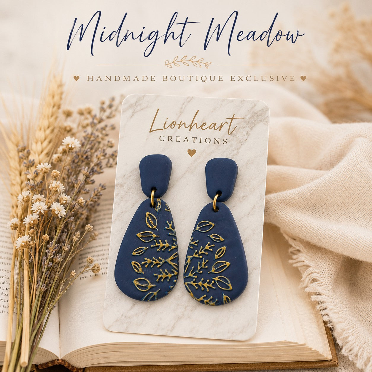 Tea-Shirt Shoppe Midnight Meadow navy blue polymer clay teardrop earrings with embossed gold botanical leaf patterns.