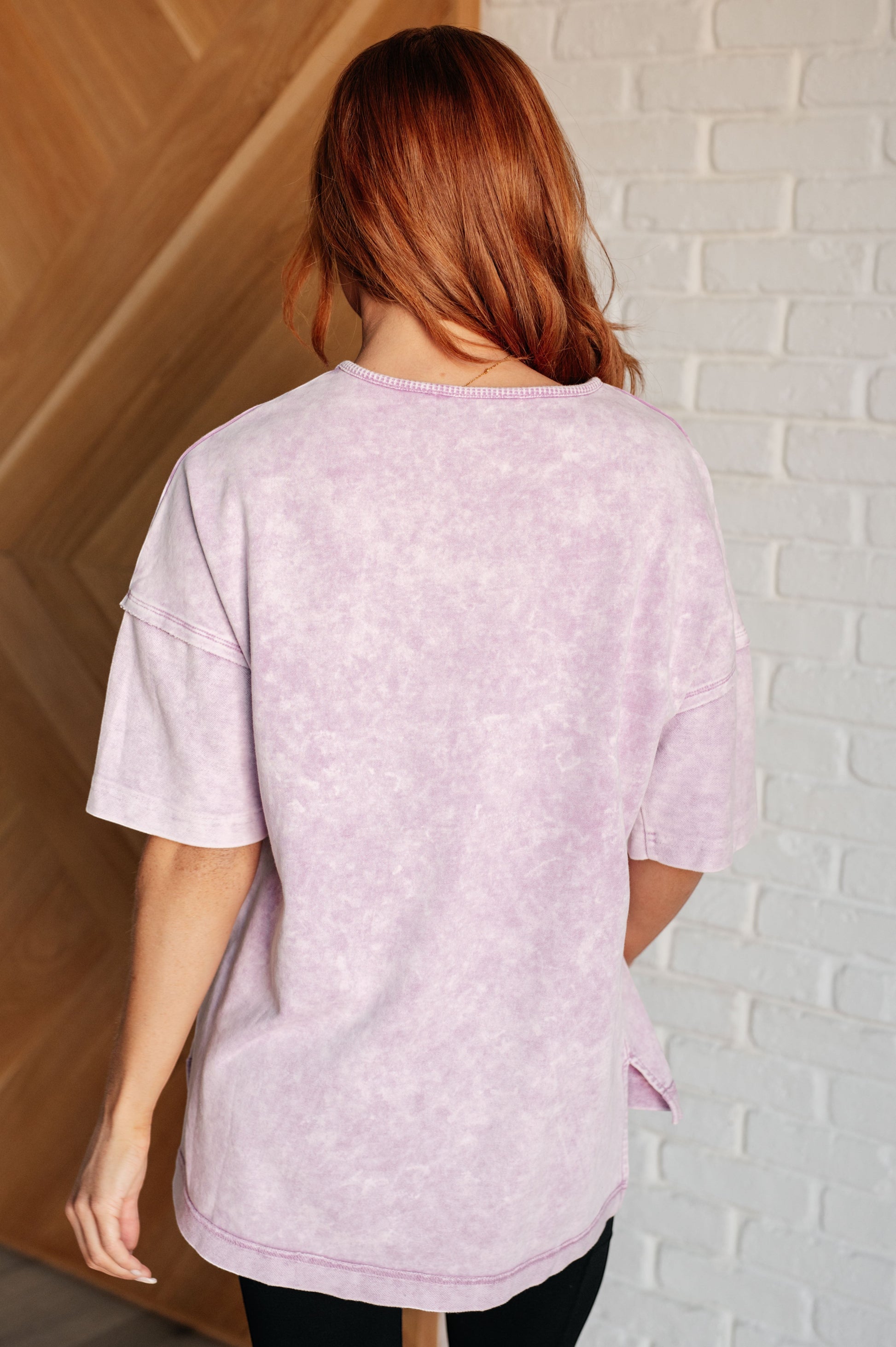Tea-Shirt Shoppe Unbothered mineral wash top in orchid petal featuring a drop shoulder and raw edge back view