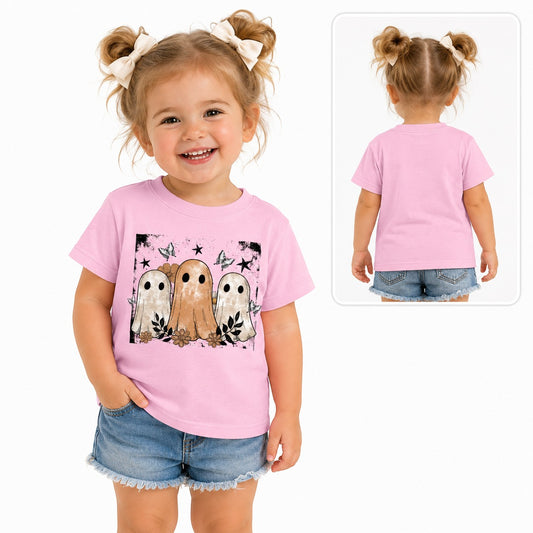Toddler girl wearing a Tea-Shirt Shoppe pink graphic tee featuring vintage ghosts, flowers, and stars.