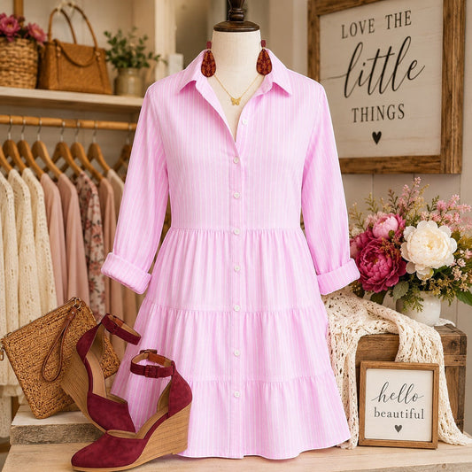 Tea-Shirt Shoppe pink and white striped tiered shirt dress with collar and three-quarter sleeves on a mannequin.