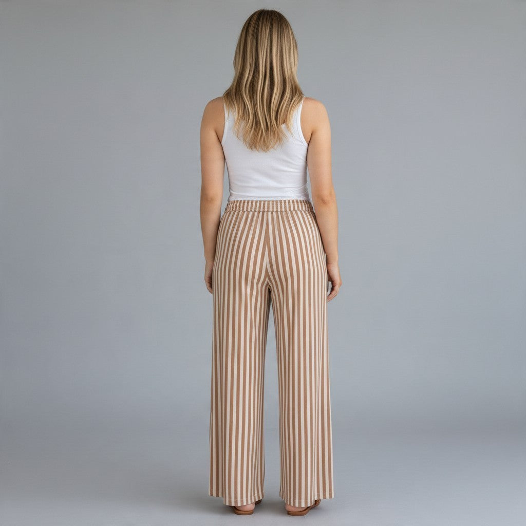 Tea-Shirt Shoppe striped oversized wide leg pants in neutral tones with an elastic waistband, back view on a model.
