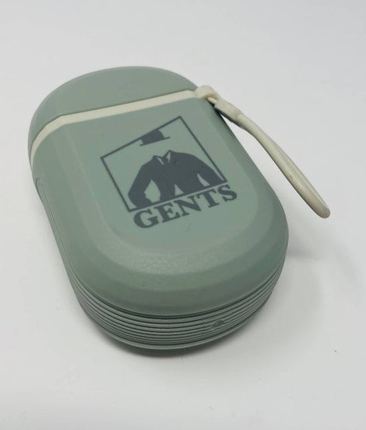 Tea-Shirt Shoppe sage green leakproof travel soap container with GENTS logo and carrying strap for gym or camping.