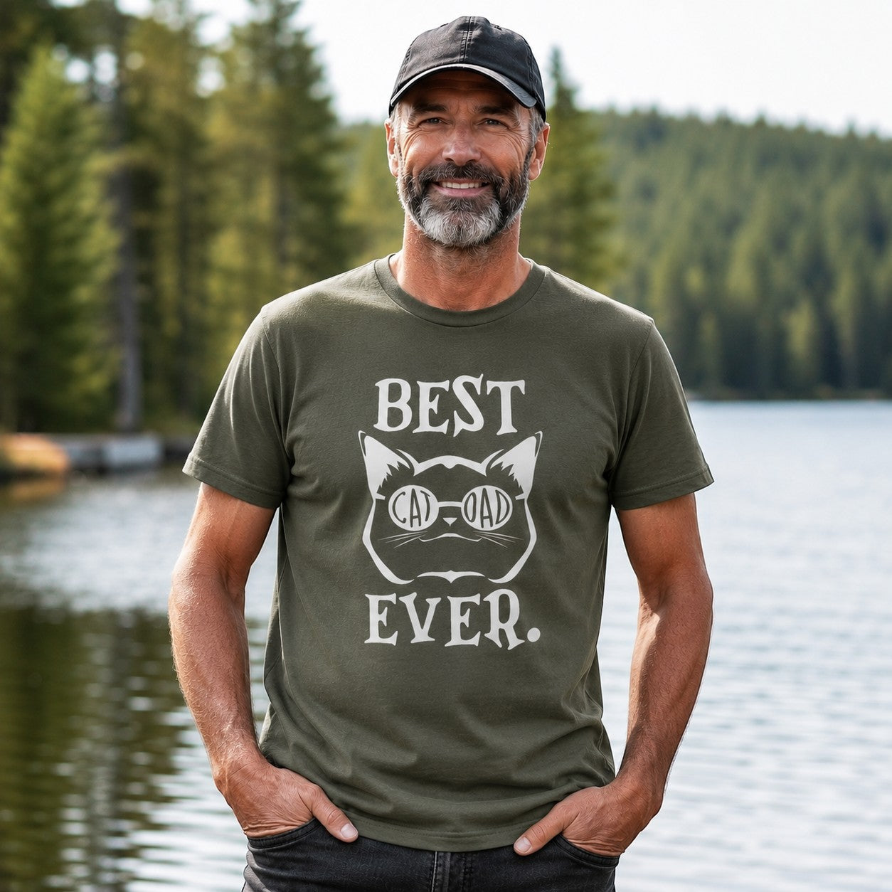 Tea Shirt Shoppe Wholesale olive green t-shirt with "Best Cat Dad Ever" graphic featuring a cat wearing glasses.
