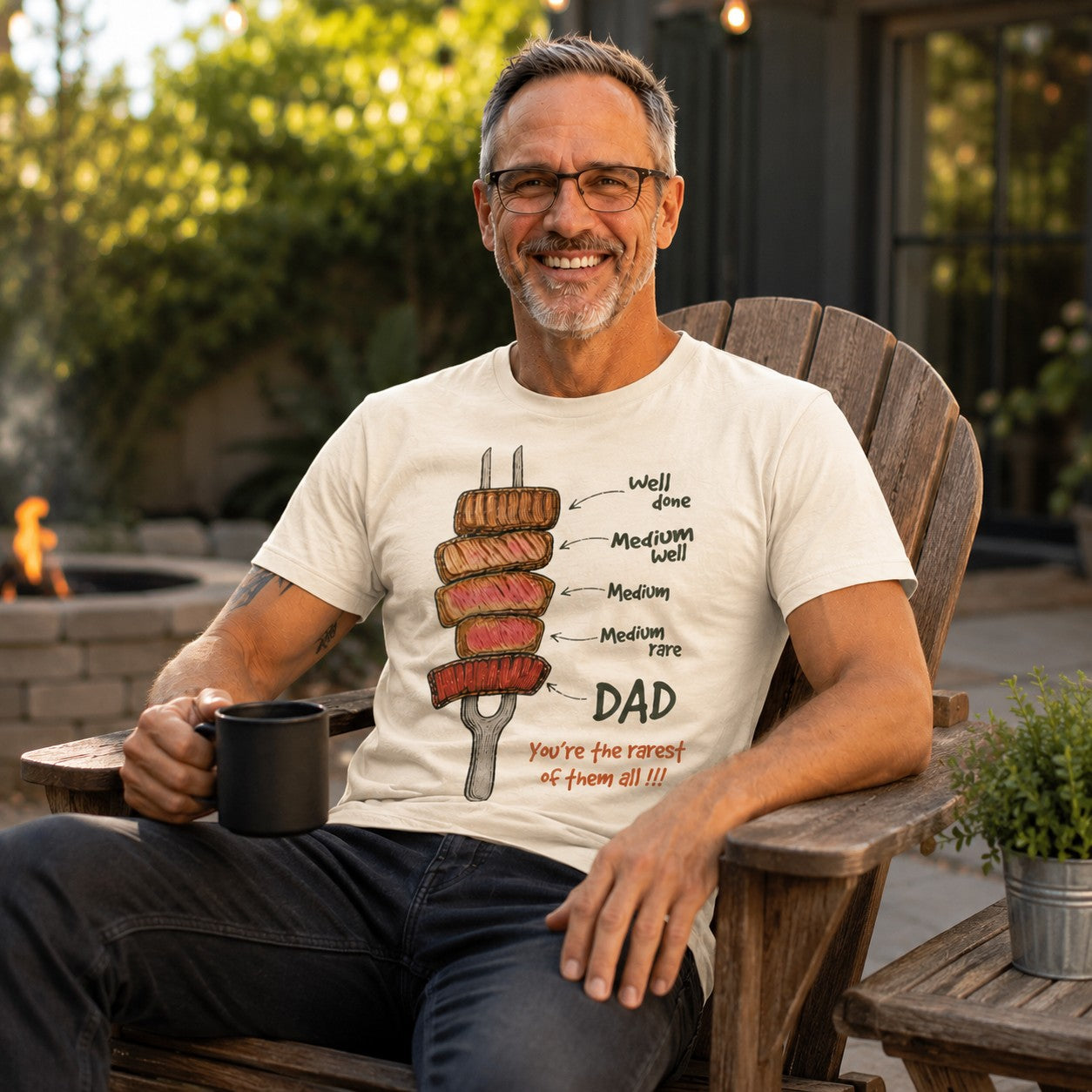 Tea Shirt Shoppe Wholesale cream graphic tee with steak doneness levels and "DAD You're the rarest of them all!!!" text.