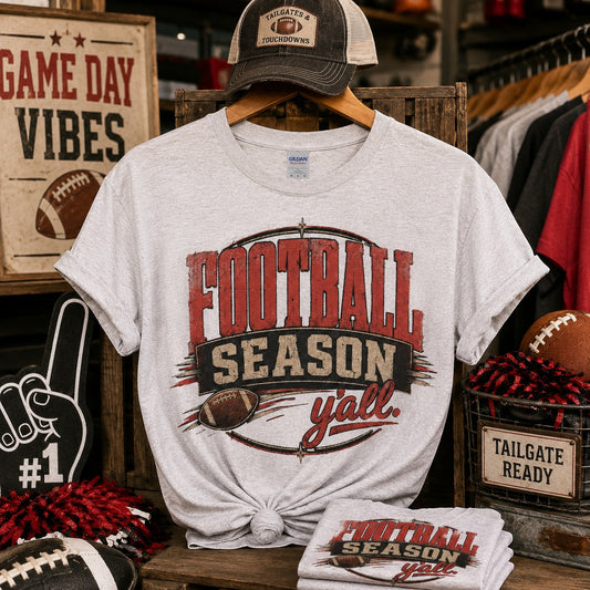 Tea Shirt Shoppe Wholesale ash grey Gildan graphic tee featuring a distressed Football Season Y'all print design.