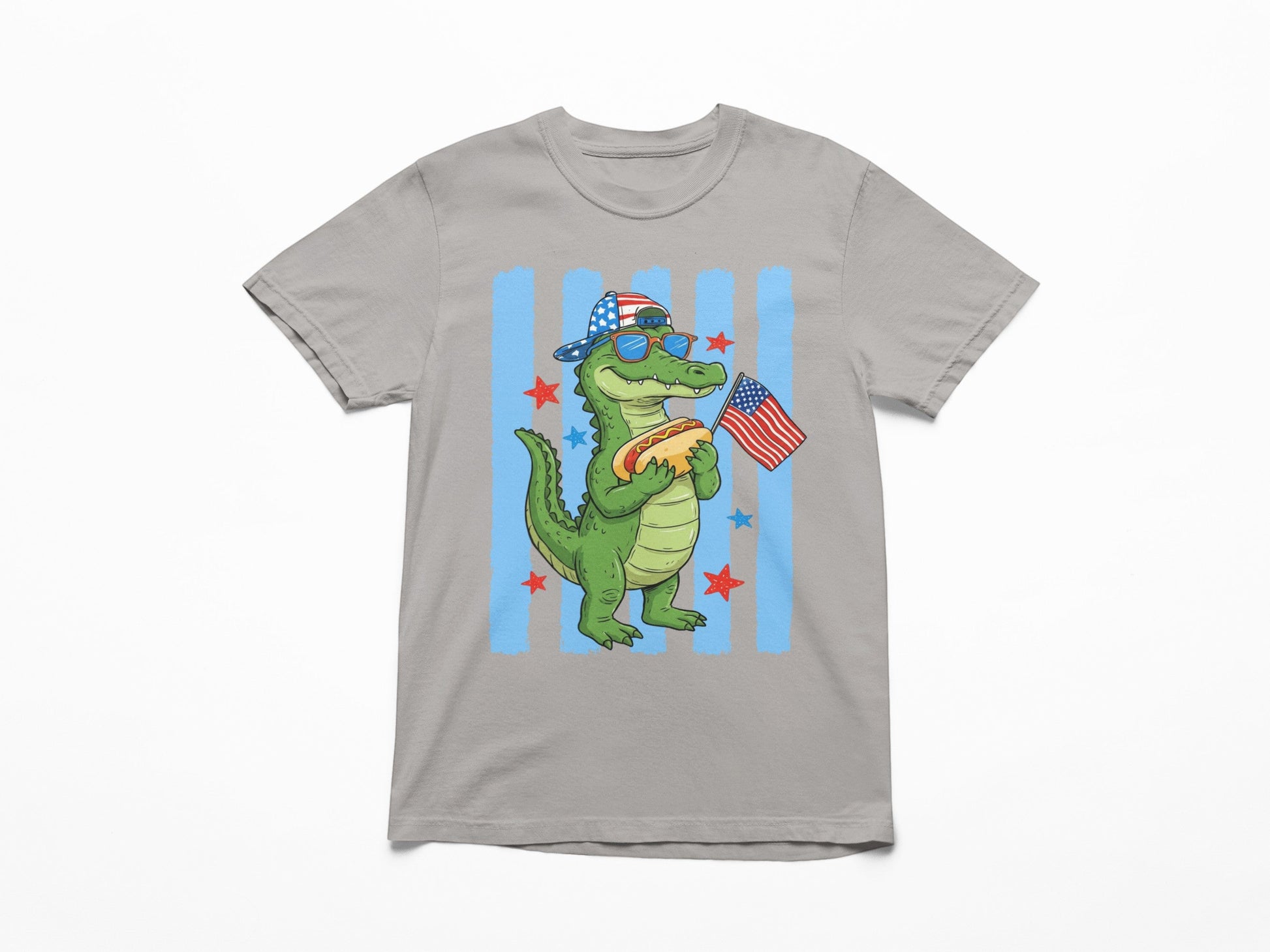 Tea Shirt Shoppe Wholesale grey 100% cotton youth graphic tee with a cartoon alligator wearing sunglasses and a flag hat, holding a hot dog and an American flag.
