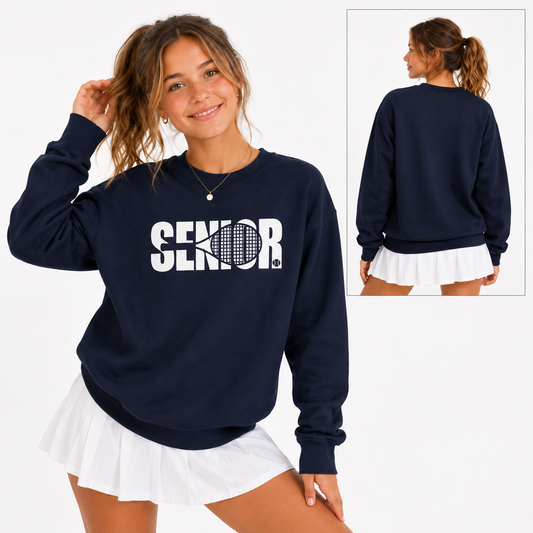 Tea Shirt Shoppe Wholesale navy blue crewneck sweatshirt with white Senior tennis graphic worn by a smiling woman