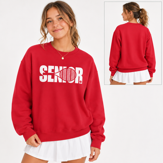Tea Shirt Shoppe Wholesale red crewneck sweatshirt with white Senior tennis graphic worn by a smiling woman