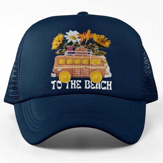 Tea Shirt Shoppe Wholesale navy blue trucker hat with a graphic of a vintage van filled with flowers and the text "TO THE BEACH".