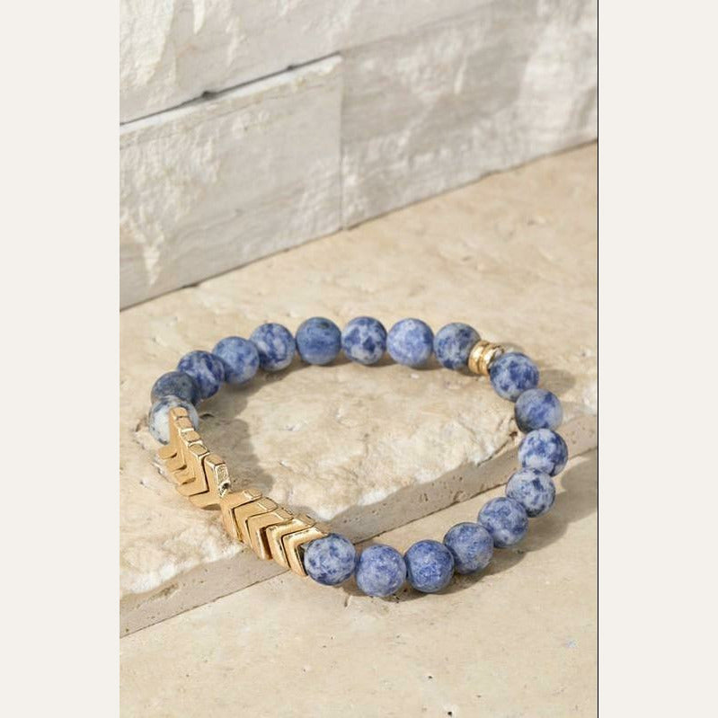 This is a super cute natural sodalite stone stretch bracelet with a metal chevron pendant.