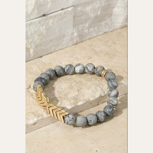 This is a super cute natural crazy jasper stone stretch bracelet with a metal chevron pendant.