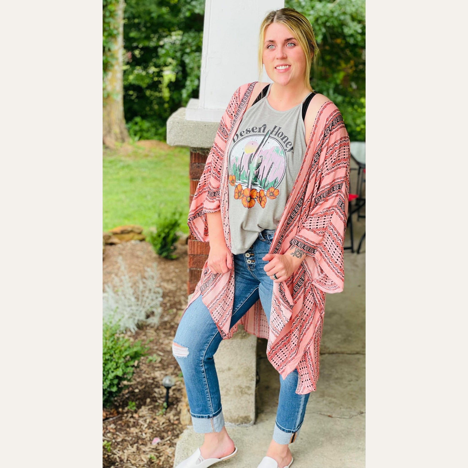 The Gabriella kimono is perfect for a casual look to beachwear. She has a super cute print with side slits designed in a lightweight material.  100% Rayon