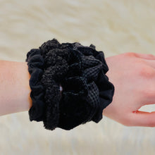 These adorable scrunchies are the perfect addition for your ponytail or wrist! Assorted Textured Scrunchies card features 5 hair scrunchies in assorted Black tones.