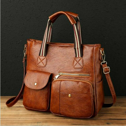Complete your outfit with this caramel faux leather luxury designer handbag. This messenger-style handbag features multiple pockets, a long shoulder strap, and plenty of room. This handbag is a nice midsize purse. 12.5" x 11.5" x 5".