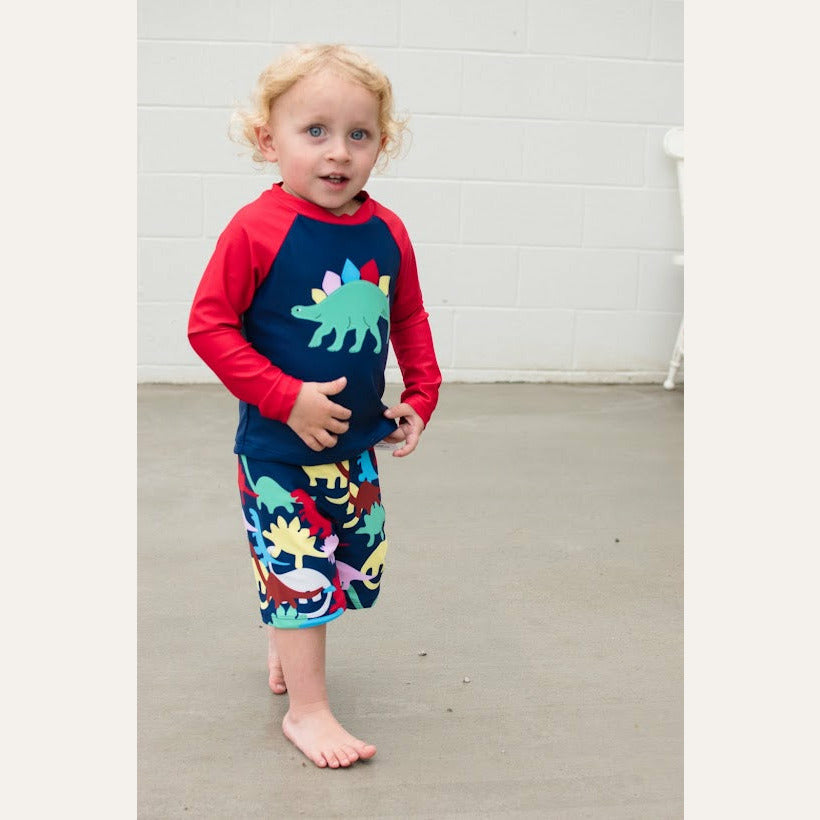Perfect for your babysaurus who loves to swim! Complete with swim trunks and matching swim top. Protect your baby so you can relax in the sun.  Fits true to size. Polyester / Spandex.   Lined.