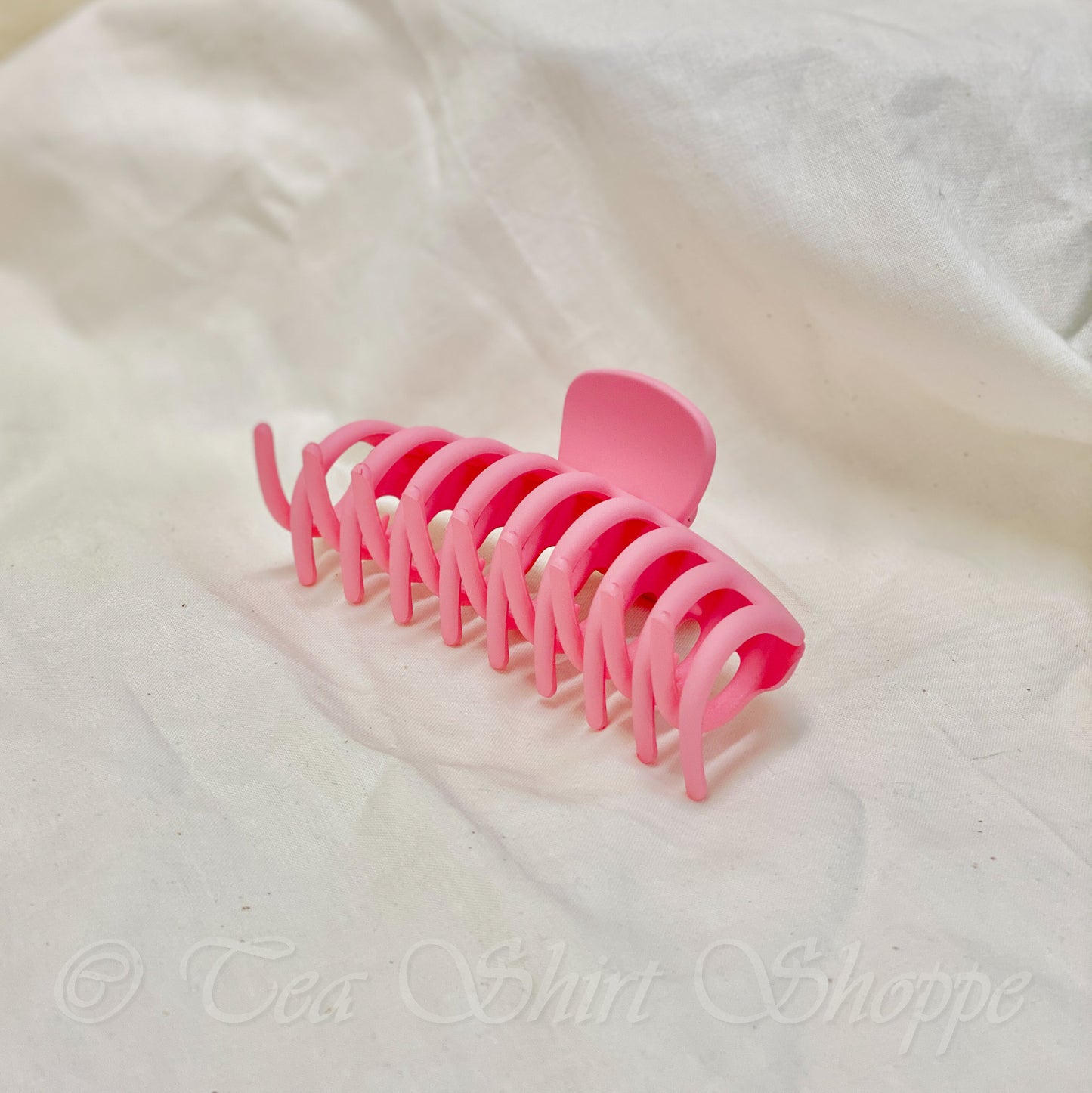 pink claw clip laying on side