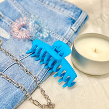 bright blue claw clip on jeans