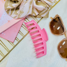 flat lay of pink claw clip
