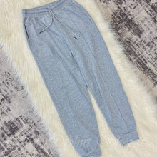 Introducing our new Heather Grey Tapered Lounge Pants! This lounge wear staple comes in a trendy tapered style with cuffed hem and drawstring waist, meant to give you an effortlessly stylish and comfortable look. 