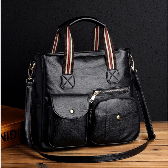 Complete your outfit with this black faux leather luxury designer handbag. This messenger-style handbag features multiple pockets, a long shoulder strap, and plenty of room. This handbag is a nice midsize purse. 12.5" x 11.5" x 5".