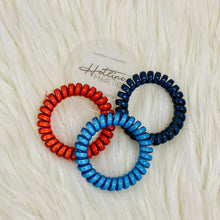 Packaging information: Each box of original and skinny size hair ties includes one of our Tighten Up cards (pictured with the packaging).