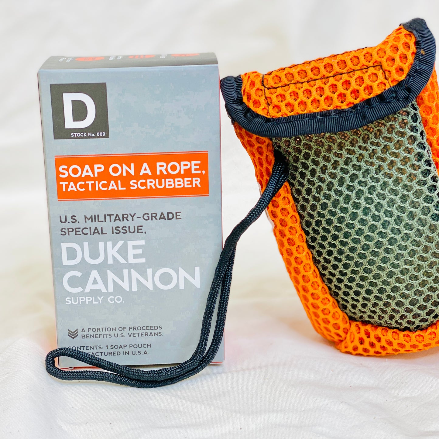 The Tactical Soap on a Rope Scrubbing Pouch from Duke Cannon is engineered with paracord and sturdy mesh to eliminate the slippery fuss of traditional bar soap.