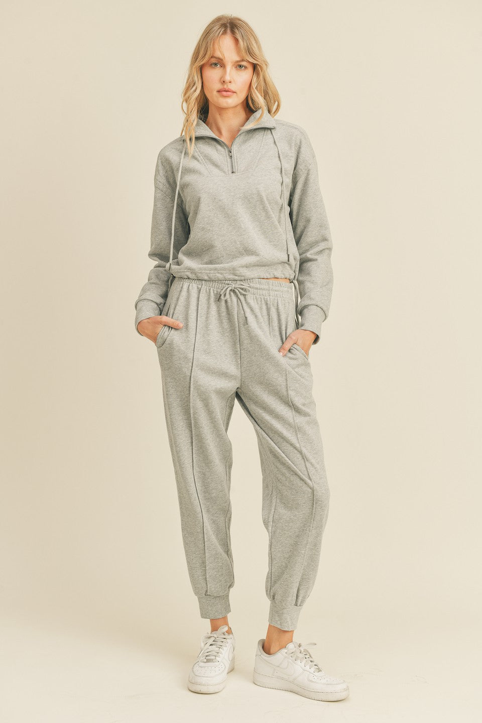 Heather Grey Tapered Lounge Bottom Introducing our new Heather Grey Tapered Lounge Bottoms! This lounge wear staple comes in a trendy tapered style with cuffed hem and drawstring waist, meant to give you an effortlessly stylish and comfortable look. Crafted with the utmost care from soft, premium fabrics, these bottoms are sure to be your go-to for days spent relaxing at home.
