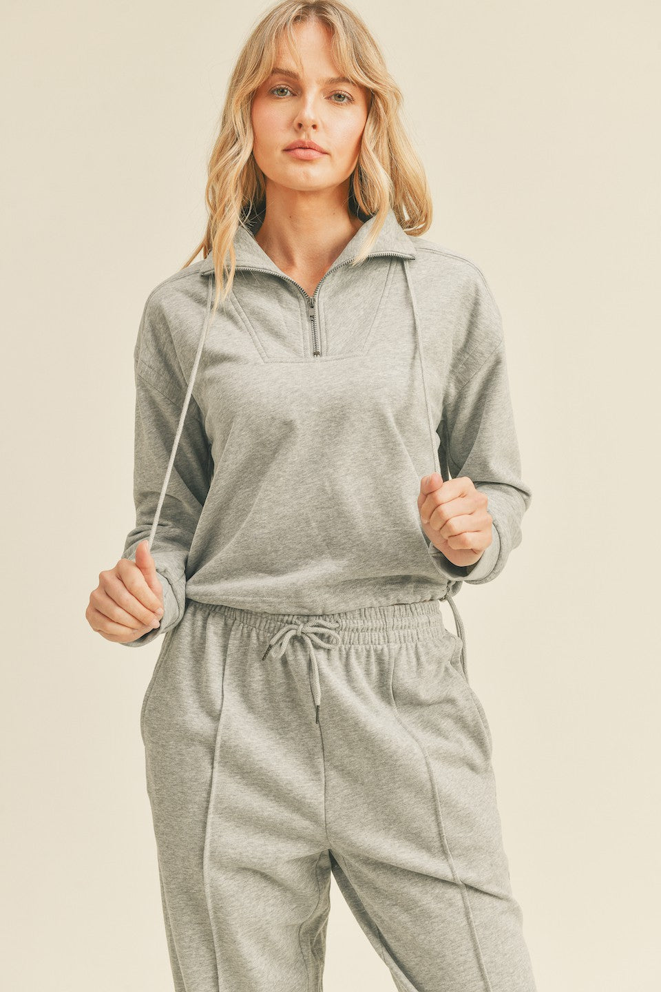 Crafted from soft cotton French terry fabric and featuring an indigo half zip closure, slightly cropped fit, drawstring hem, and a chic flattering silhouette. This pullover is truly the ideal piece of activewear that's perfect for your daily routine! Look good, feel great in the Cotton French Terry Cropped Pullover - designed with you in mind.  HPS  S - 20" M - 20.5" L - 21"