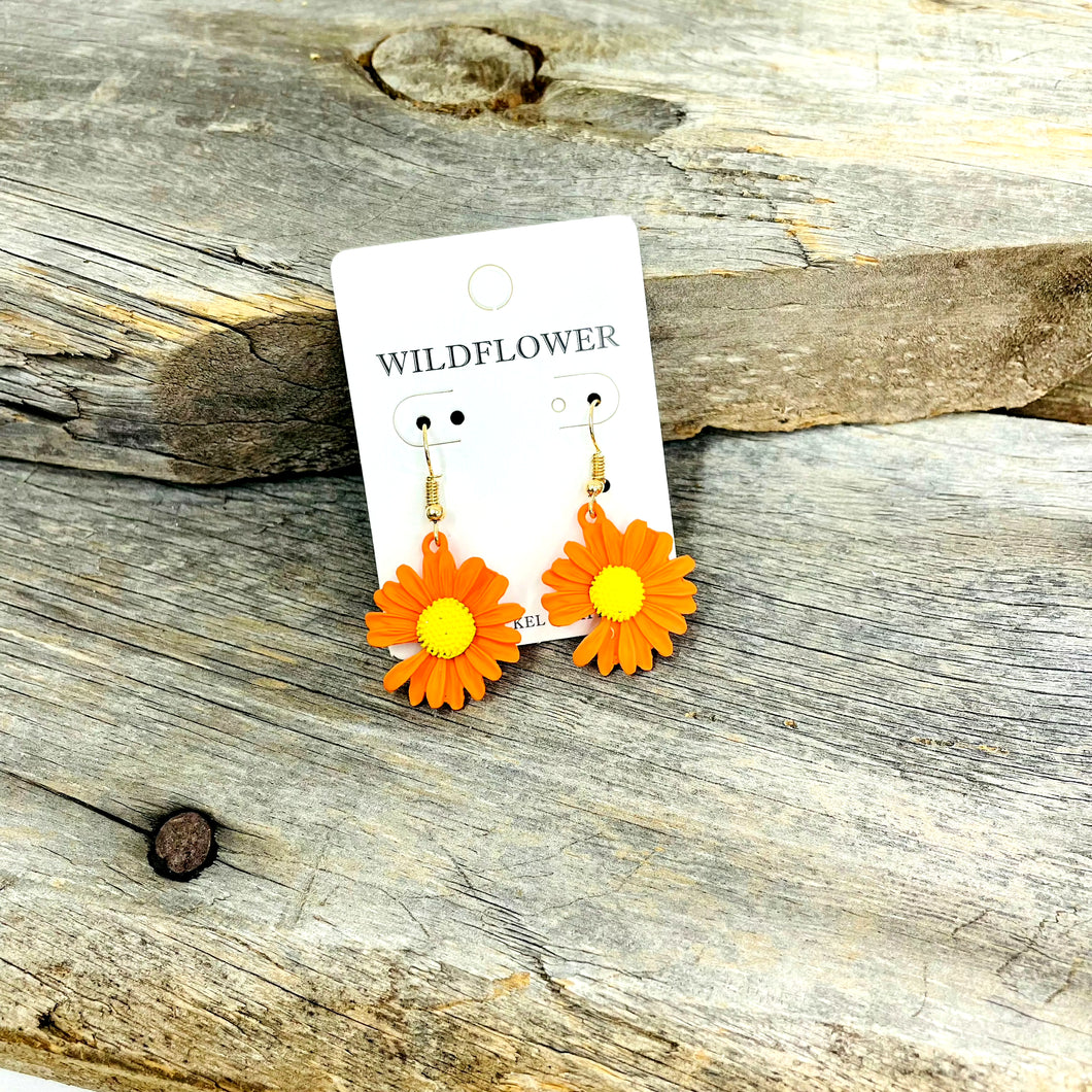 ﻿                                              Orange Flower Earrings  The Perfect Flare to add to your spring outfit.  Lead And Nickel compliant Flower  Dangle Orange  Tea Shirt Shoppe 417-262-8828