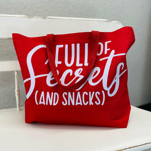 Full Of Secrets Red Bag  As Damian once said "that's why her hair is so big, it's full of secrets". If you're a mean girls kinda person you HAVE to get this bag. Very spacious so you have plenty of room for snacks and secrets.  %100 cotton  Tea Shirt Shoppe 417-262-8828