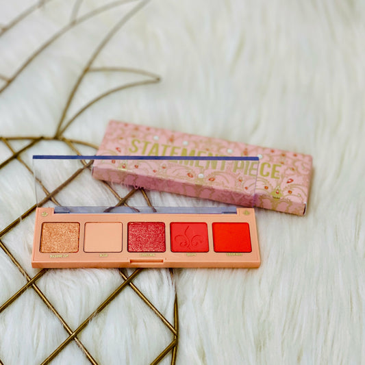 Sign your statement look with xoxo. This electric coral Statement Piece Eyeshadow Palette from ColourPop features a range of 2 glimmering metallics and 3 saturated mattes. Create a look all your own.