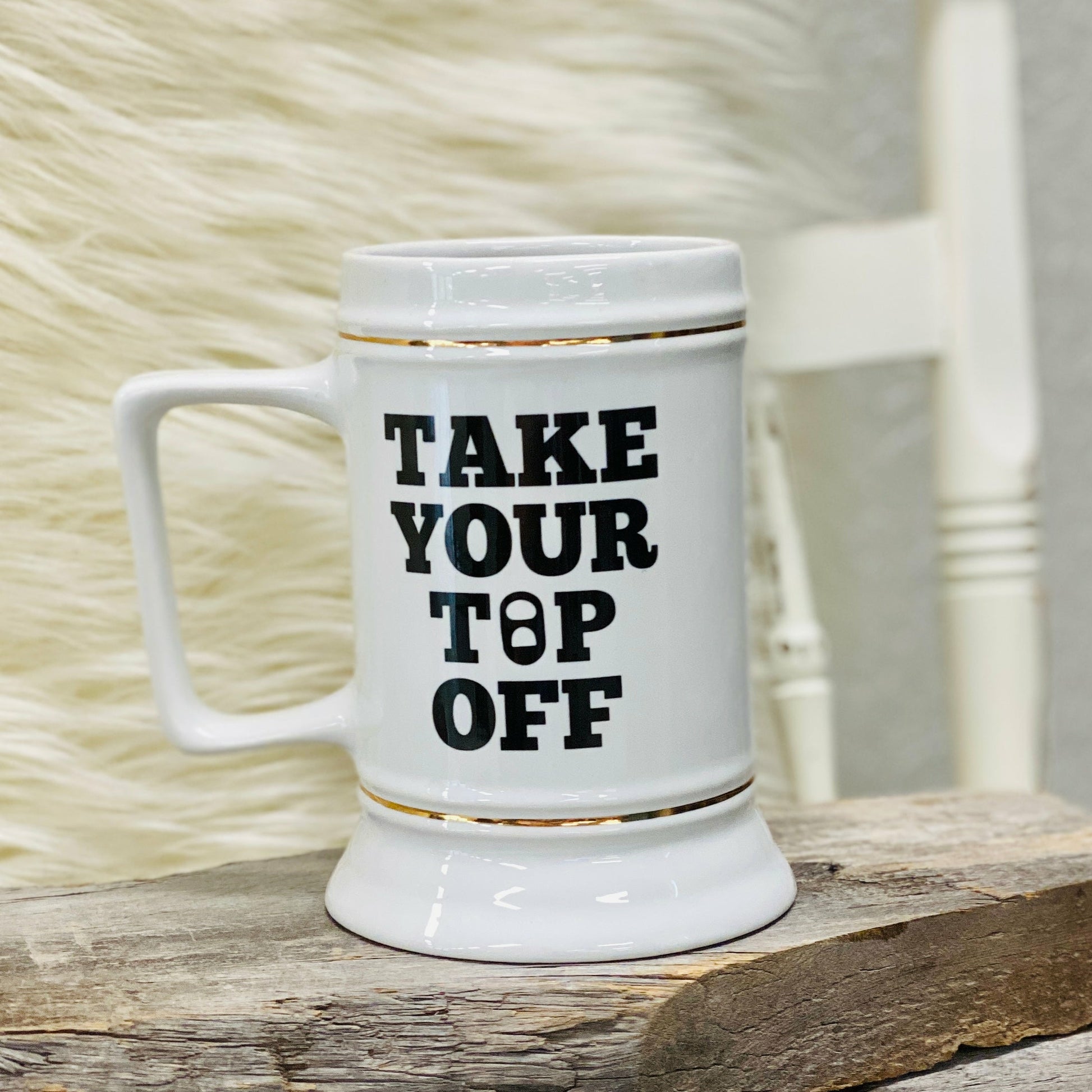 Take Your Top Off 28oz Beer Stein The graphic design on this stein says, "Take your top off," in bold black letters.  The design is on both the left and right side of the stein.   28 oz Stein, 12-12.25" round X 6.25" Tall; White with Gold Trim,Dishwasher Safe, for maximum life of the imaged product, we recommend hand washing. This stein meets or exceeds FDA requirements for food and beverage safety.