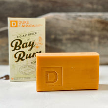 Our Big Ass Brick Of Soap - Bay Rum is intended to celebrate this remarkable spirit through the invigorating scent combination of citrus musk, cedarwood, and island spices.  Offer your hard-working customers the best possible $10 vacation (in a box).  PRODUCT SPECS: • At 10 oz., it's 2-3x the size of common, dainty soaps • Triple milled for superior quality • Made in the USA  Size: 10 oz. bar