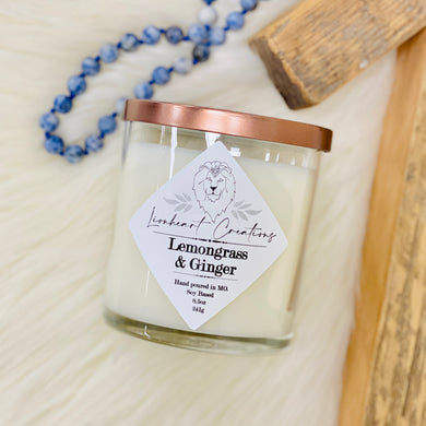 Lemongrass & Ginger Soy Based Candle  Start your day with a burst of freshness with Lionheart Creation's hand poured Lemongrass & Ginger candle. Enjoy the uplifting fragrance as you get ready for your day.  Soy based Glass jar Suction seal lid 8.5 ounces