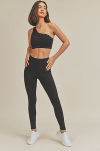 One Shoulder Active Sports Bra Introducing our One Shoulder Active Sports Bra! With a unique one-shoulder design and comfortable mesh inlay, this sports bra is perfect for all types of active wear. 