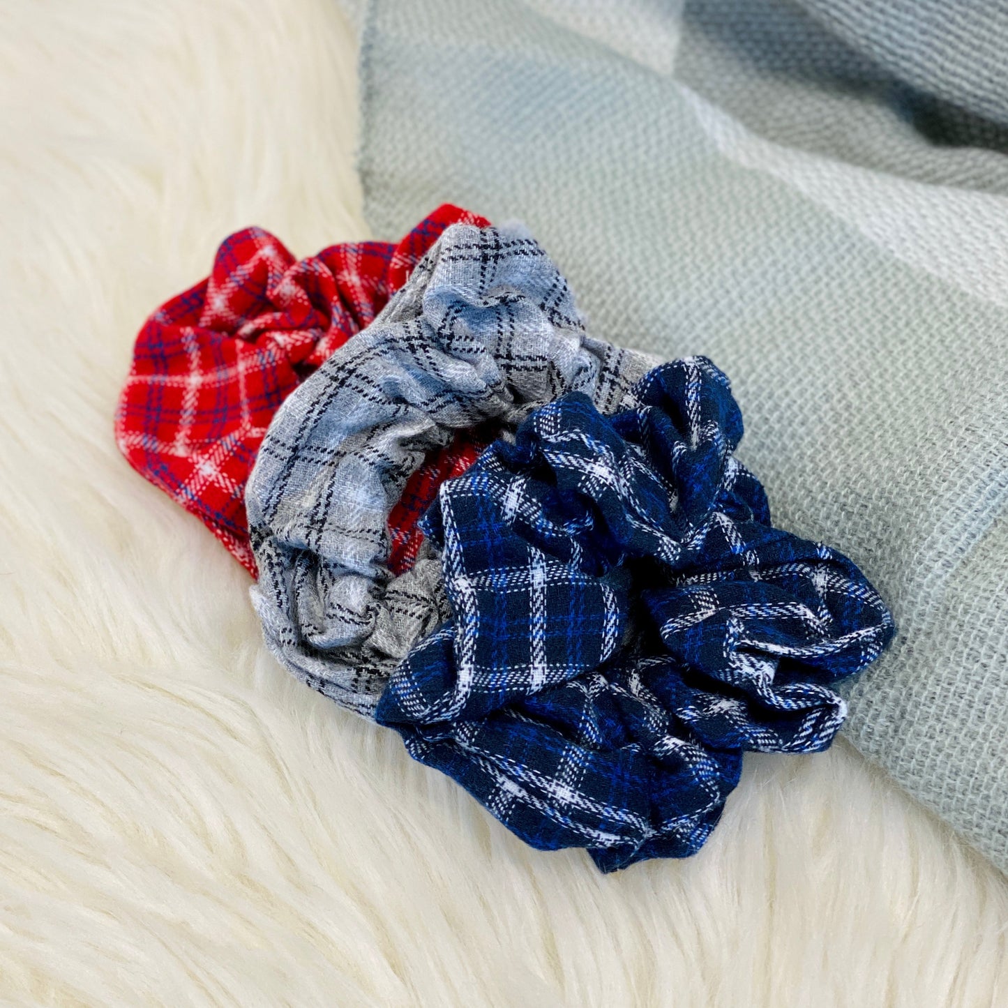 Our Varsity Flannel Scrunchie Set has three scrunchies that are different color flannel prints. Perfect to match with your favorite outfit for fall! Also available in our Fall Flannel Scrunchie Set which has softer flannel print tones.